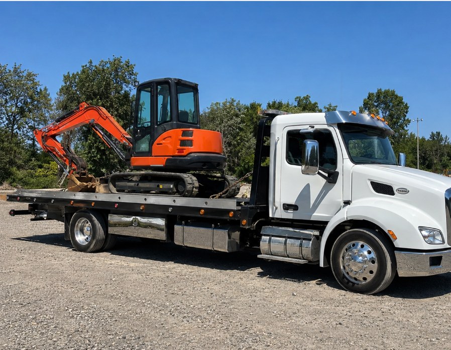 Heavy-haul trailer transporting CAT articulated dump truck